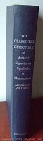 Side view of the navy blue hardcover book's spine showing the title and publisher 'Graham'.