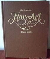 Front cover showing brown hardcover with gold embossed text 'The Standard Fine Art Value Guide'.