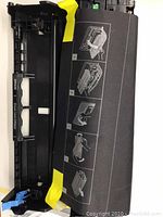 Ink cartridge DR820 with visible yellow and blue levers along with user guide.
