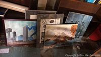 Overview of six framed artworks arranged upright