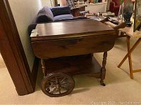 Side view of tea cart with leaves closed