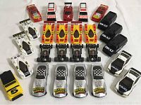Twenty-two plastic slot car bodies in red, white, yellow and black including SWAT and Police graphics