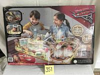 Original box showing the Disney Pixar Cars 3 Thomasville track set with children playing