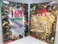 Front covers of two I Spy books, Christmas and Treasure Hunt editions, showing colorful photographic covers with slight wear.