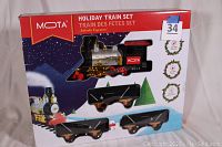 Boxed Mota Holiday Train Set showing front with train graphics and window display of engine and three cars