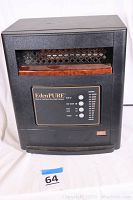 Front view of the EdenPURE portable heater showing the overall black body with a dark brown horizontal trim and metal grill on the upper front section.