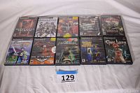 Photo showing all 10 PlayStation 2 game cases arranged in two rows with a numbered label in front.