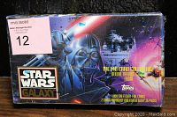 Front of the sealed box showing Darth Vader artwork and branding details with mention of 140 card collection and etched-foil cards.