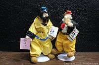 Brutus and Wimpy vintage 12-inch figures standing side by side on white stands with original tags attached.