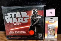 Photo of brand new sealed box set The Star Wars Vault. Dark box with Darth Vader on the cover and 30 years of Lucasfilm archive memorabilia inside.