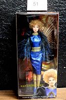 Full view of the Effie Barbie doll inside original packaging with Hunger Games Catching Fire branding.