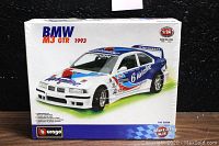 Front view of sealed Burago BMW M3 GTR 1993 1/24 metal model kit box showing the displayed model car and branding.