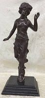 Front view of standing Art Nouveau lady metal figure on base