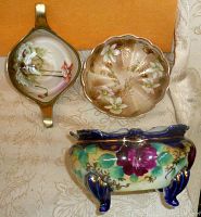Top view of all three Nippon Japan porcelain footed bowls showing floral hand-painted artwork and gold accents on each bowl.