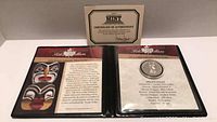 Display photo showing certificate of authenticity with coin inserted and text about the Royal Canadian Mint.