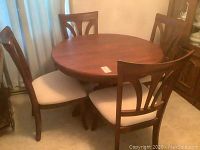 Full set view: round table and six chairs arranged around