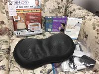 Photo showing Dr-HO'S Back Support Belt in packaging, Dr-HO'S Muscle Therapy Unit box, Relaxzen massage pad and accessories laid out on sofa.