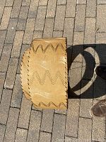 Top view of two-tier circular lampshade showing wavy pattern design and stitched edges.