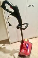 Full side view of the TORO electric power shovel showing the handle, trigger, and cord.