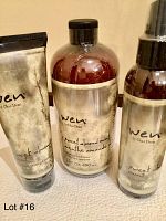 Three WEN hair care products in Sweet Almond Mint: Anti-Frizz Styling Cream in a tube, Cleansing Conditioner in a bottle, and a Replenishing Treatment in a spray bottle.