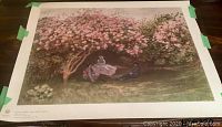 Full view of the Claude Monet print showing the artwork, taped edges, and white border.