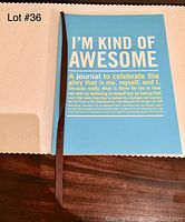 Front cover of the blue hardcover journal titled 'I'M KIND OF AWESOME' with additional subtitle text in white and yellow.