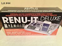 Full box front showing product name, features, compatible battery types, and phone/tablet charging functionality