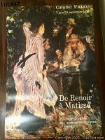 Photo of vintage Musee D'Orsay Paris Renoir exhibition poster showing impressionist painting and exhibition dates.