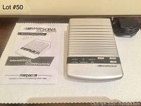 Photo showing the Marsona DS600-A sound conditioner unit, power adapter, and instruction manual laid out on a table.