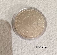 Reverse side of the silver dollar showing the XI Commonwealth Games symbol and sports symbols around the edge in a circular arrangement.