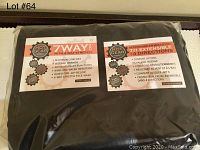 Close-up photo of Hot Gear 7 Way Stretch fabric packaging showing material characteristics including maximum comfort, intense warmth, wind and water resistance, and a face mask option.