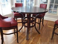 Front view of round pub table with chairs (chairs not included)