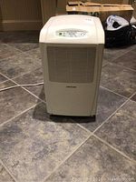 Front view of dehumidifier on tile floor