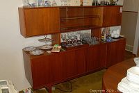 Full front view of two-piece cabinet showing upper display section and lower credenza.