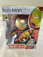 Front view of the boxed Iron Man Mini Mugg vinyl figure with Comic Con International logo and Iron Man artwork on the box.