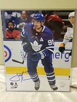 Frontal photo of the 8x10 John Tavares autographed Toronto Maple Leafs photo showing player action pose and signature.