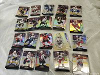 Stacked hockey cards organized by player and arranged flat on surface to display variety.