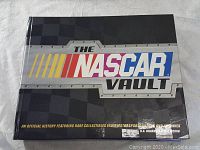 Front cover of the hardcover spiral-bound book titled 'The NASCAR Vault'