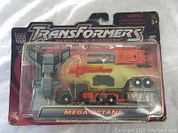Front view of original Transformers Mega-Octane toy in blister packaging showing figure and accessories in sealed pack.