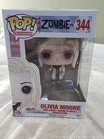 Front view of Funko Pop box showing Olivia Moore figure, box labeled 344 with iZombie branding.
