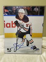 Full front view of the 8x10 signed photo of Connor McDavid with clear acrylic case visible.