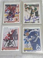 Five NHL hockey cards autographed by various players including Steve Thomas, Gordon Deneau, Trevor Kidd and Daniel Marois.