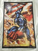 Full view of signed Captain America print with dynamic explosion background.