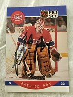 Front of signed Patrick Roy Montreal Canadiens hockey card showing player in goalie gear and autograph.