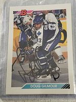 Front of Doug Gilmour hockey card with Toronto Maple Leafs action photo and autograph.