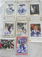 7 assorted signed NHL hockey cards in plastic holders, including rookies and star players
