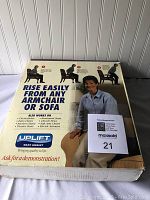 Box front showing Uplift Seat Assist branding, usage images, and claims.