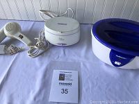 Photo showing Conair hairdryer, La Sonic paraffin wax hand bath, Radiance jewelry cleaner with lot label