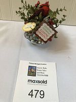 Front view of crystal bowl with red cardinal and green glittered foliage with tag