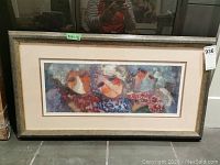 Framed limited edition abstract print with colorful face-like abstract elements.